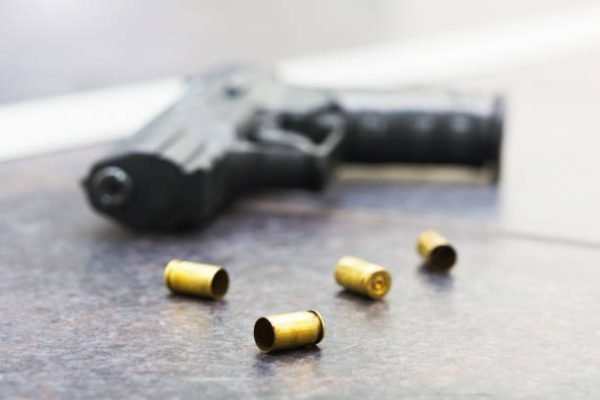 Spent cases with a handgun.
